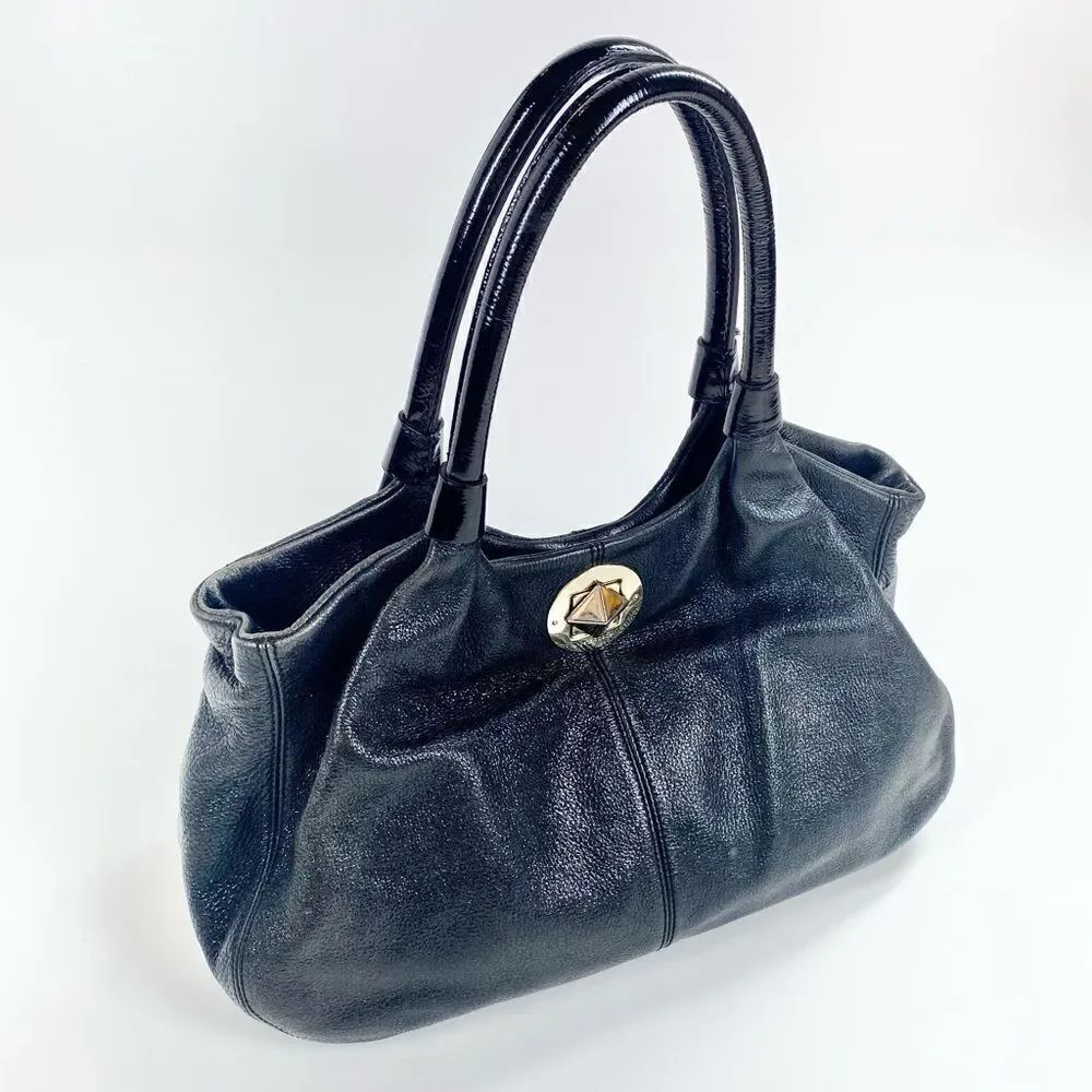 Kate Spade black leather shoulder bag w/ patent straps & gold twist clasp